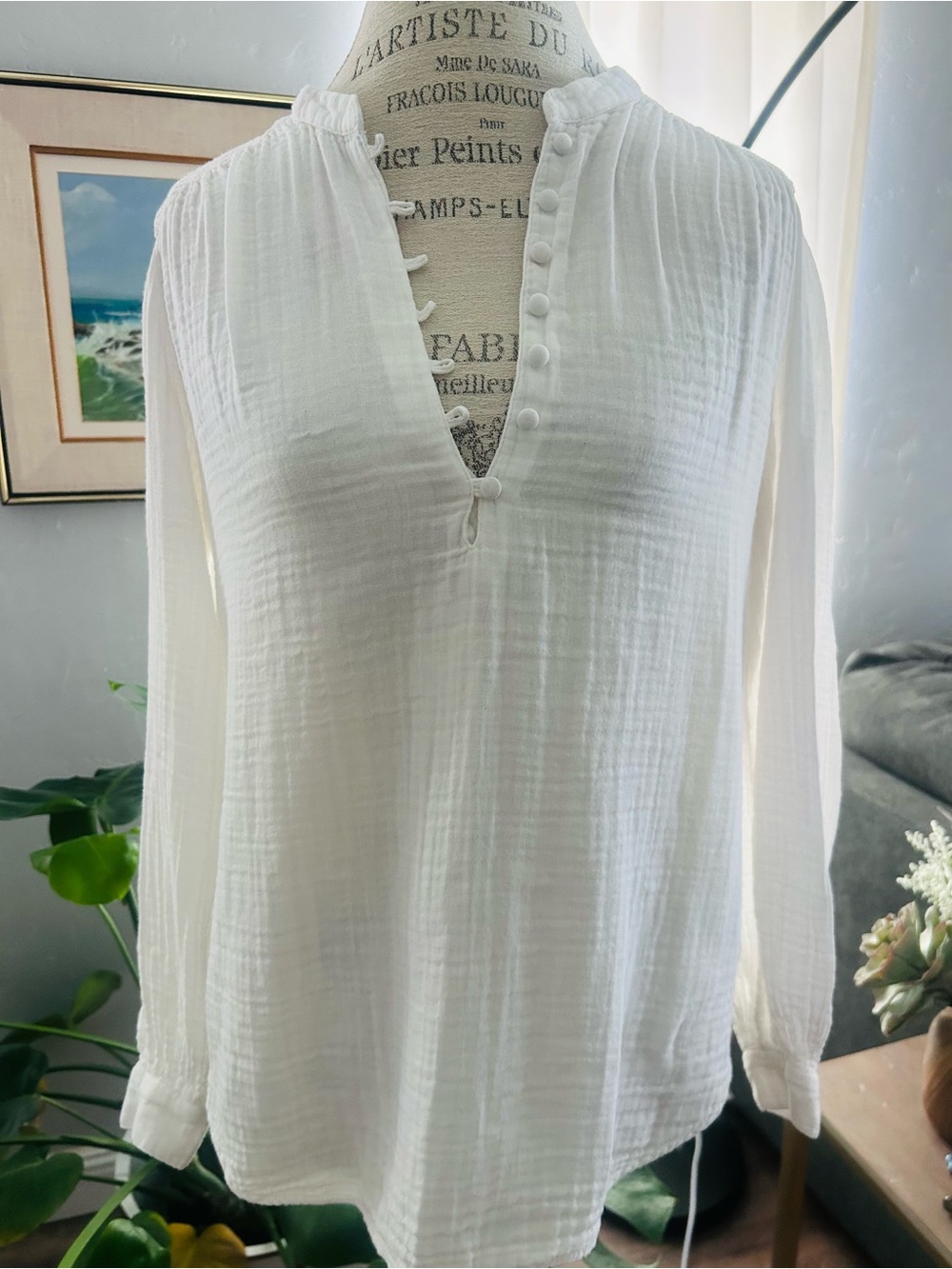 white crinkled double-gauze or muslin popover blouse